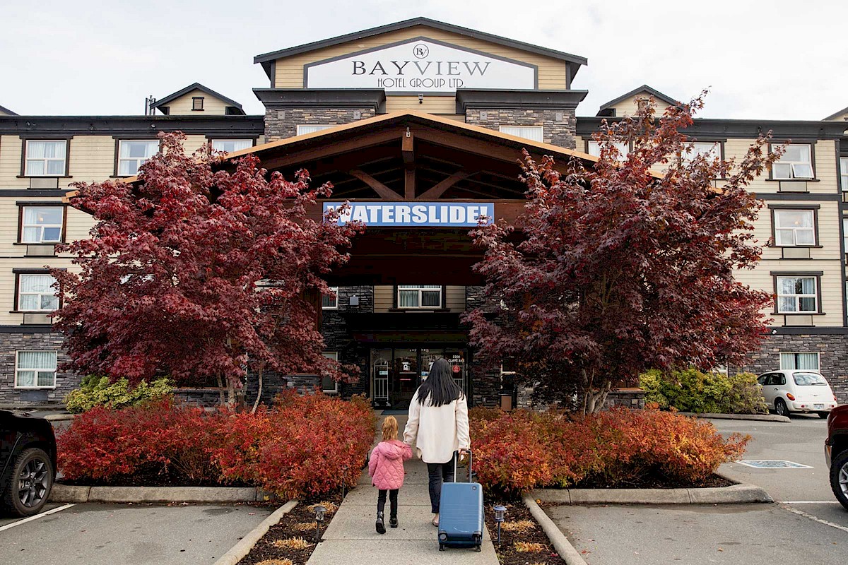 Woman and child walking up to hotel