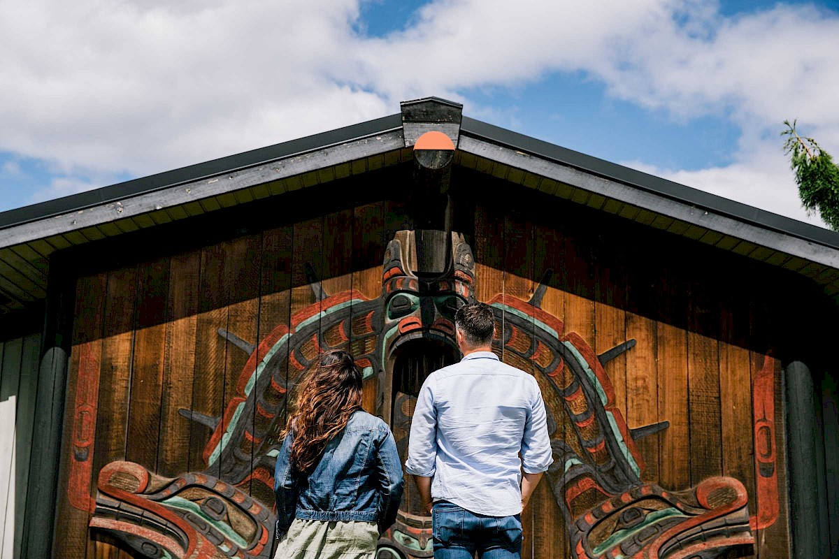 Two people looking at the outside of an art gallery