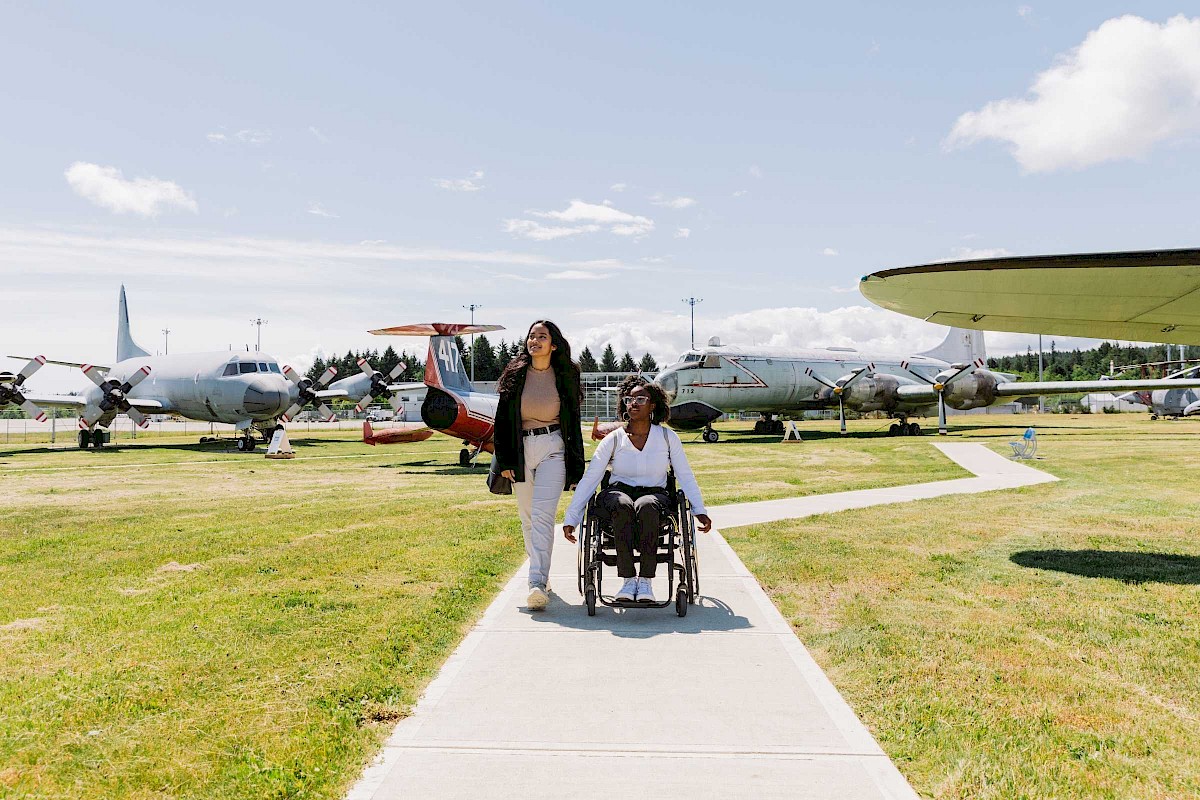 Two people walking through the Comox Air Force Museum